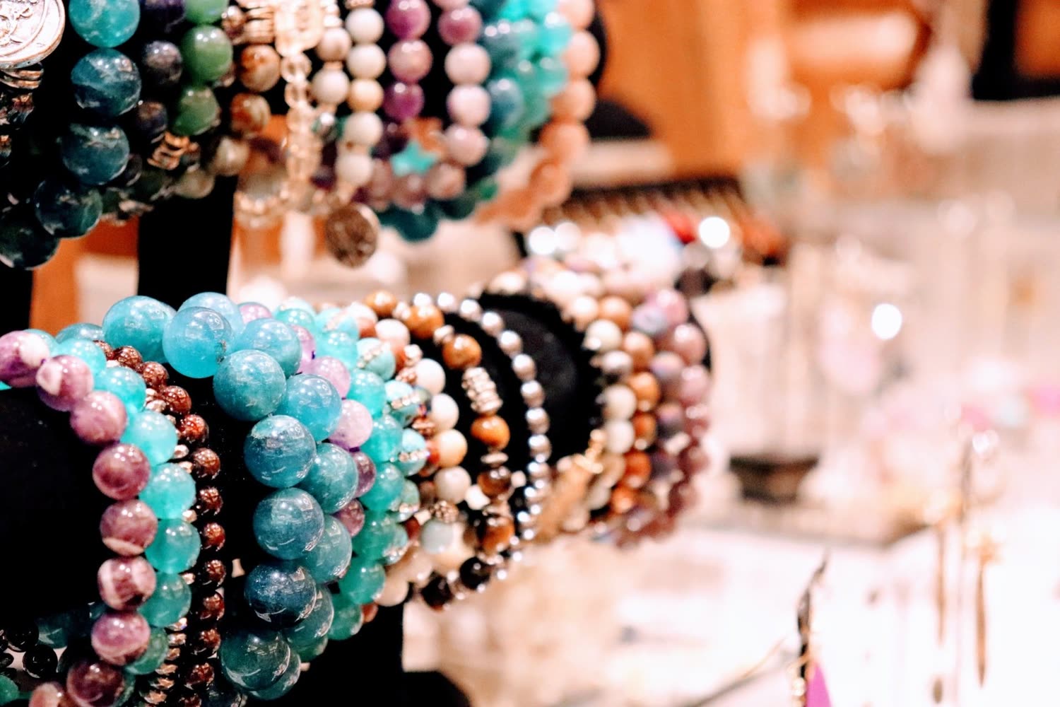 Handmade beaded bracelets on a vendor's table at an LV Craft Shows event