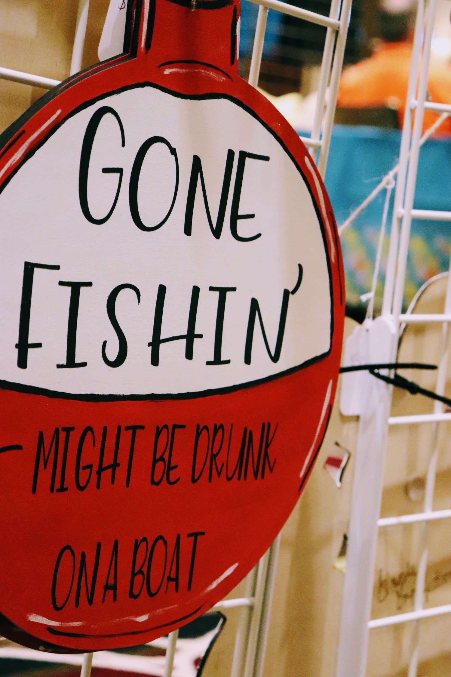 A hand-lettered "Gone Fishin'" wooden sign