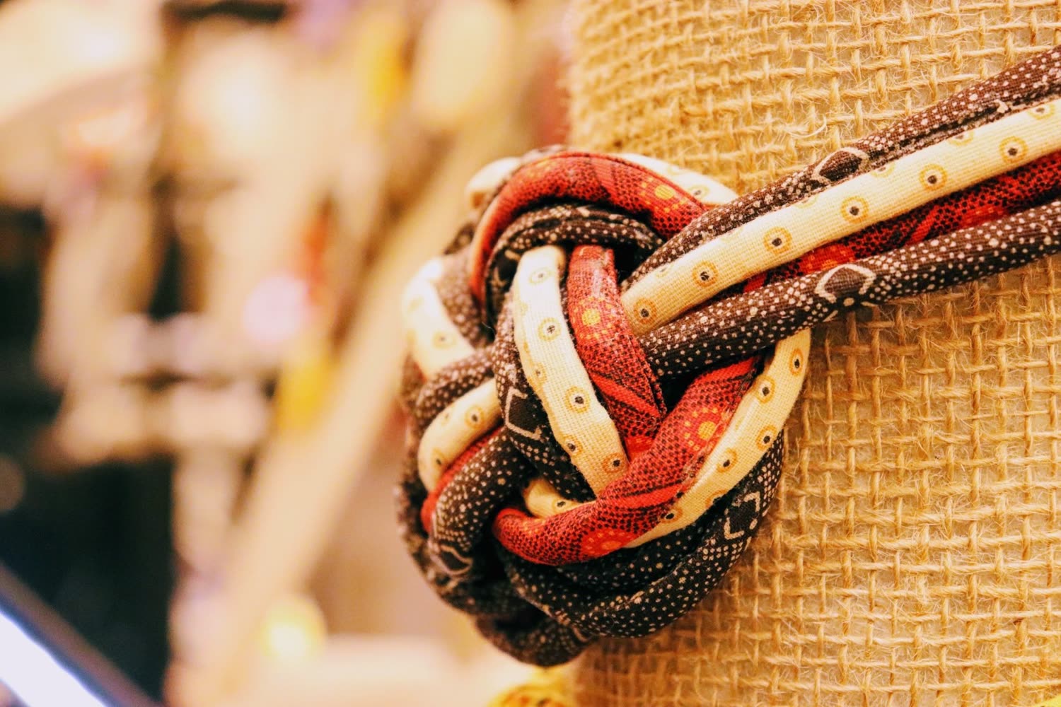 A braided fabric detail on a handmade piece