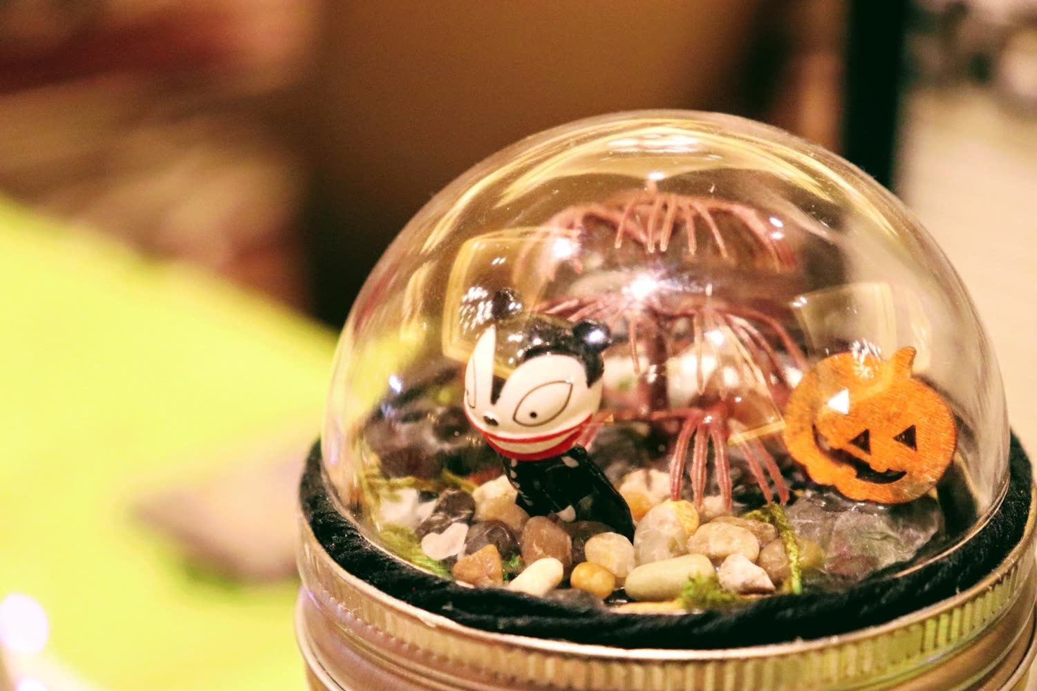 A miniature scene sealed under a glass dome