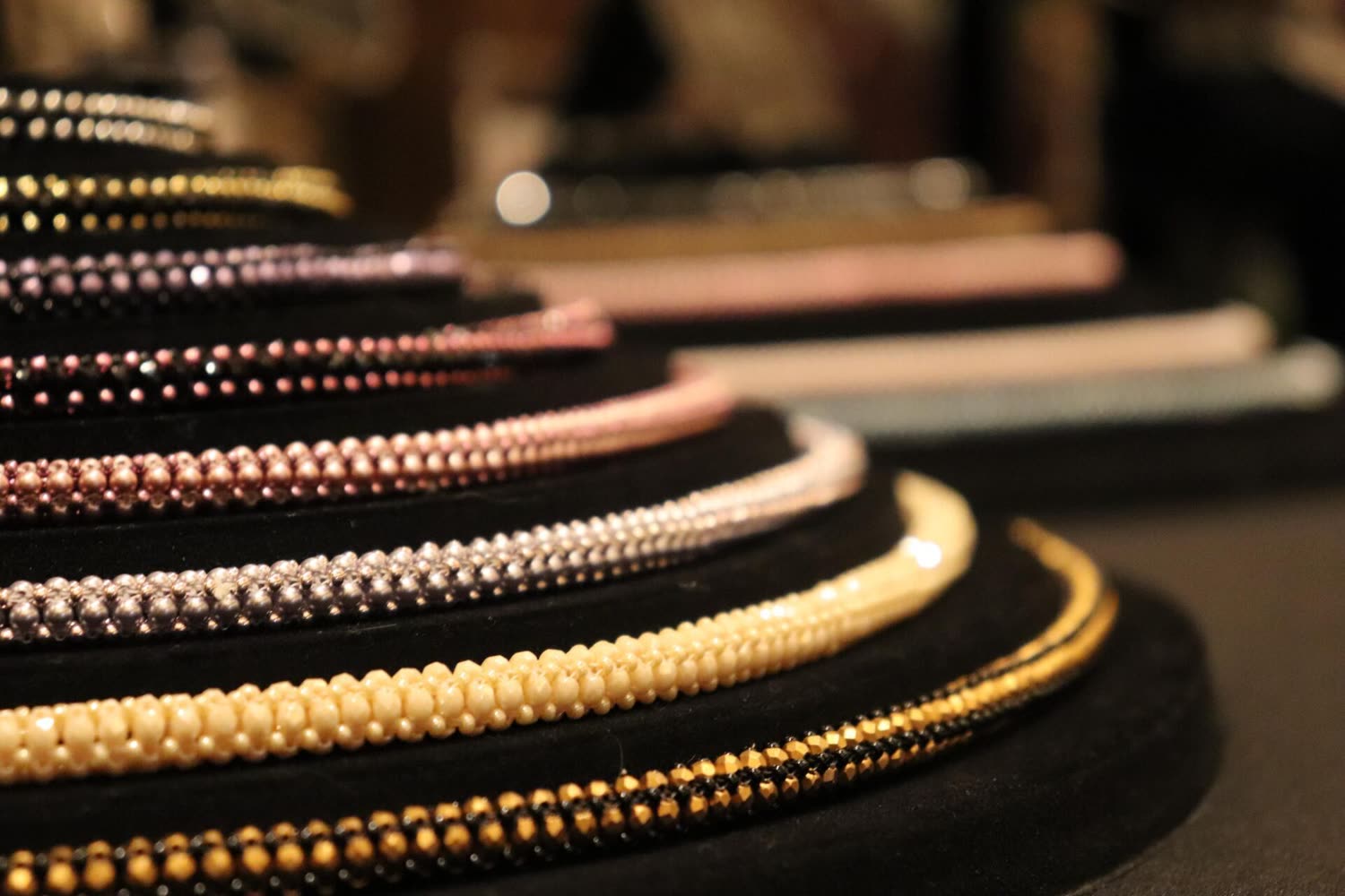 Strands of beads on a dark velvet display