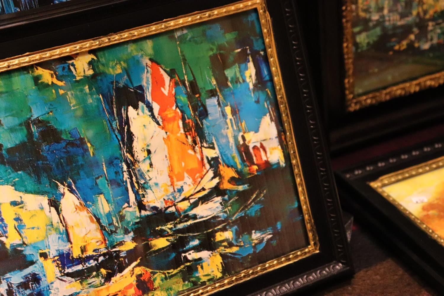Original paintings shown in a vendor's booth